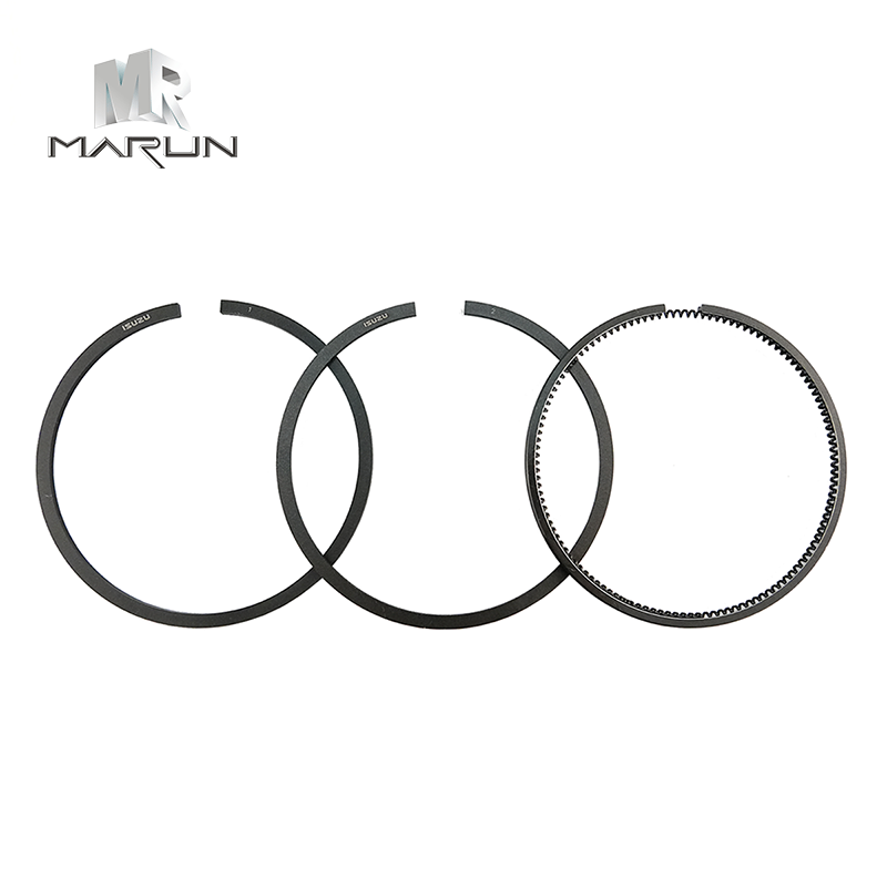 Piston rings arranged on a white background